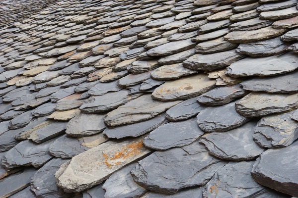 rows of slate stones create the layers for slate roofs