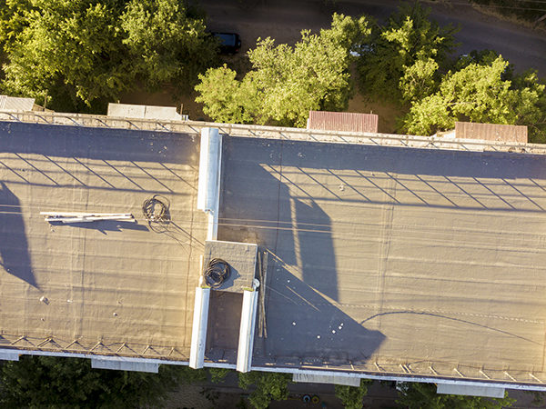 Aerial close up of an apartment flat roof in the city